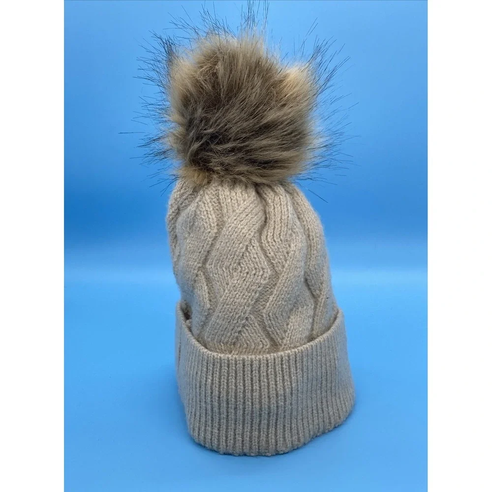 Britt's Knits Beige knit winter hat with faux fur pom pom